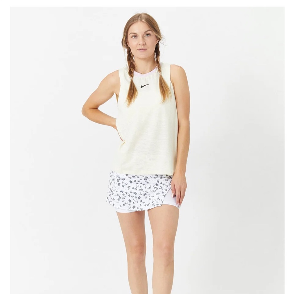 Nike athletic skirt. Has a flower print with white undershorts.